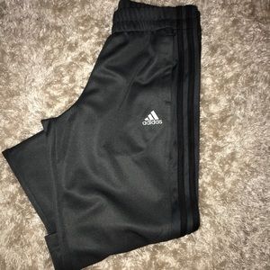 Adidas track pants. Gray with black stripes.